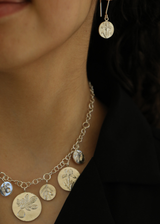 Model Wearing Sterling Silver Next Generation Coin Black Iris Drop Earrings