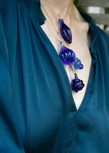 Model Wearing Azaz Dark Blue Glass Ridge Seed Pendant on Cord