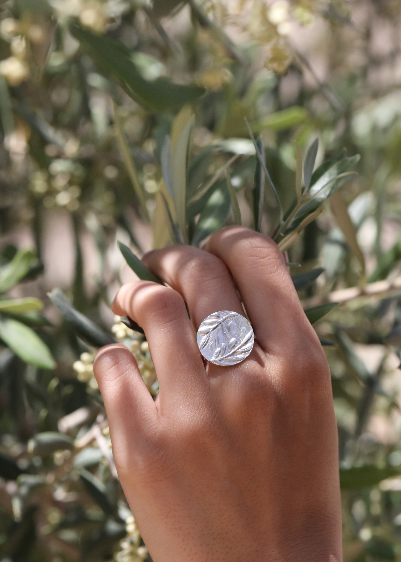 Model Wearing Sterling Silver Next Generation Disk Olive Ring