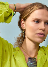 model wearing 18kt Gold Beachcomber Shell Cluster 